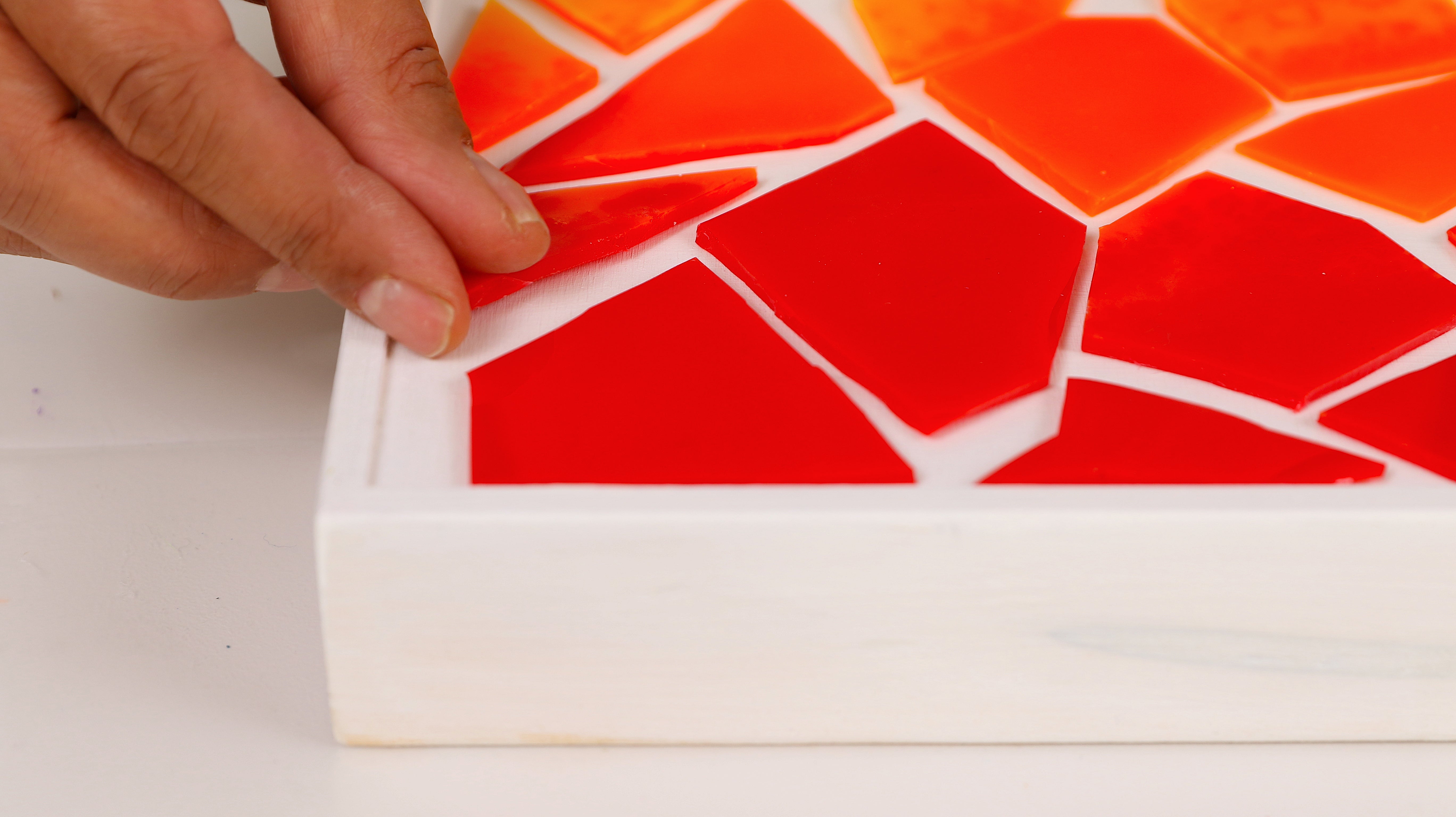 make a collage from cut resin shapes