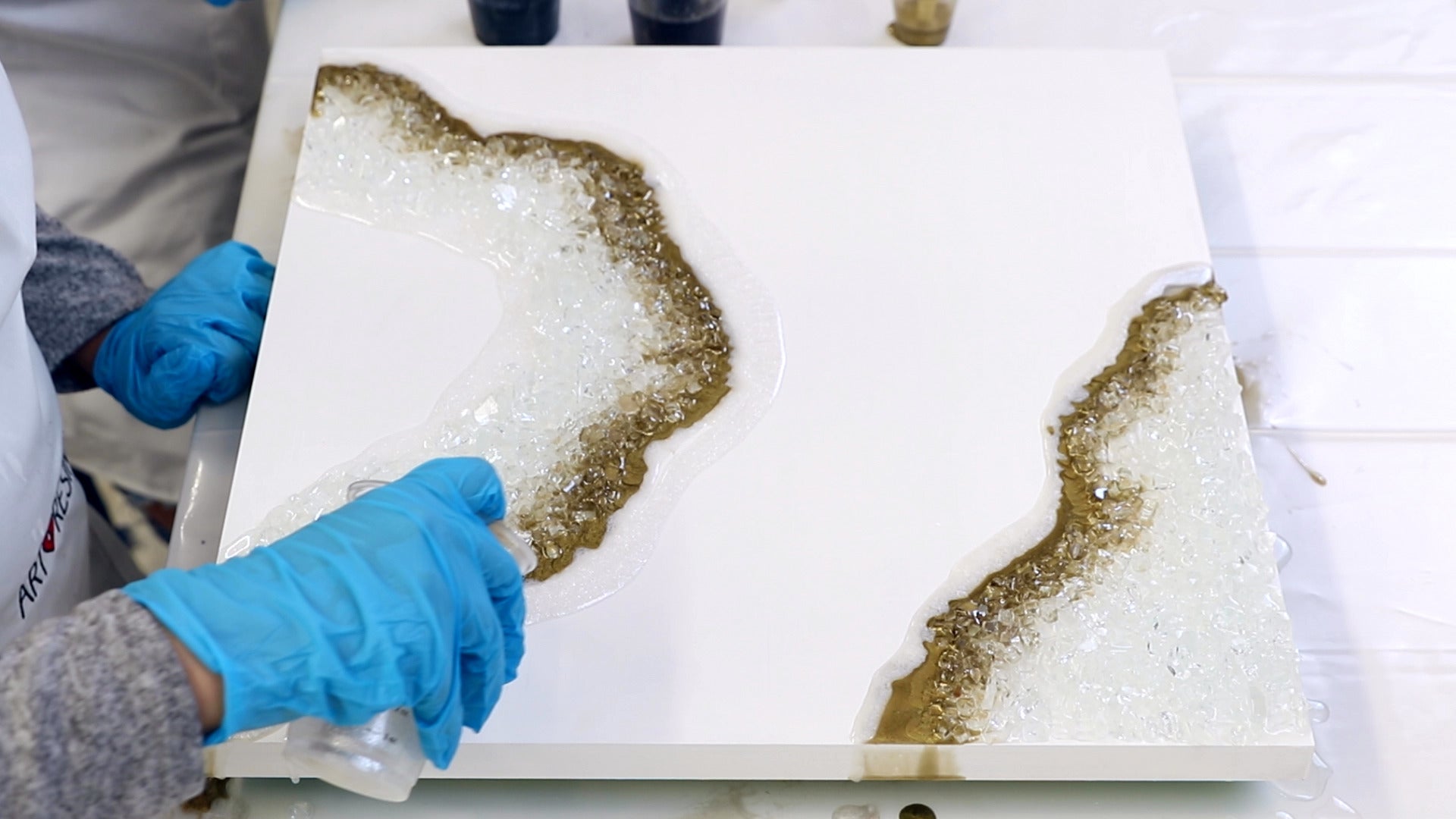 layering different shades of white resin for geode art