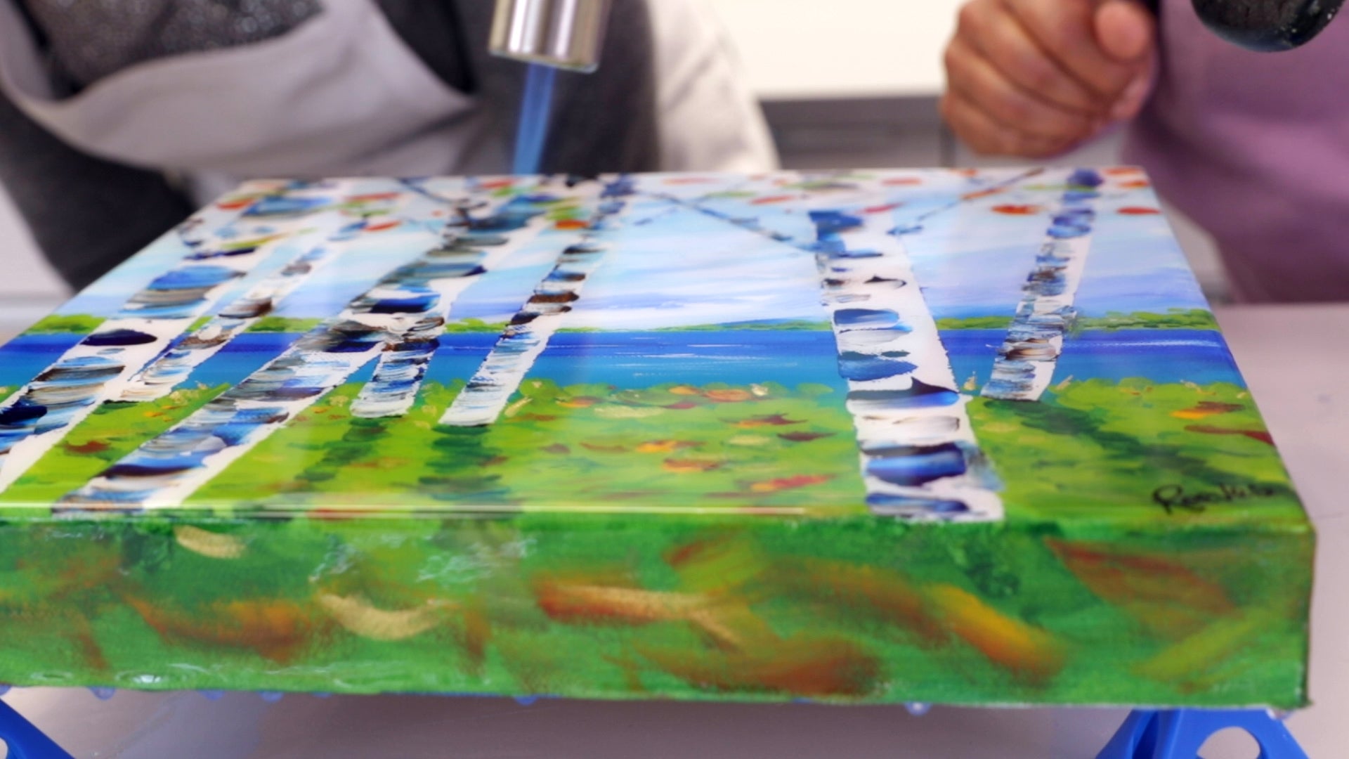 How to Resin a Canvas for Beginners: Keep the torch in a constant side to side motion