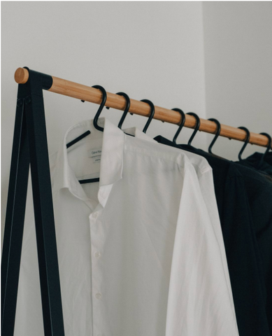 Men's clothing on a clothing rack.