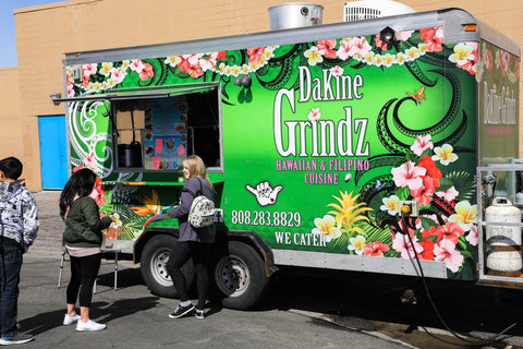 Food truck parked called DaKine Grindz.