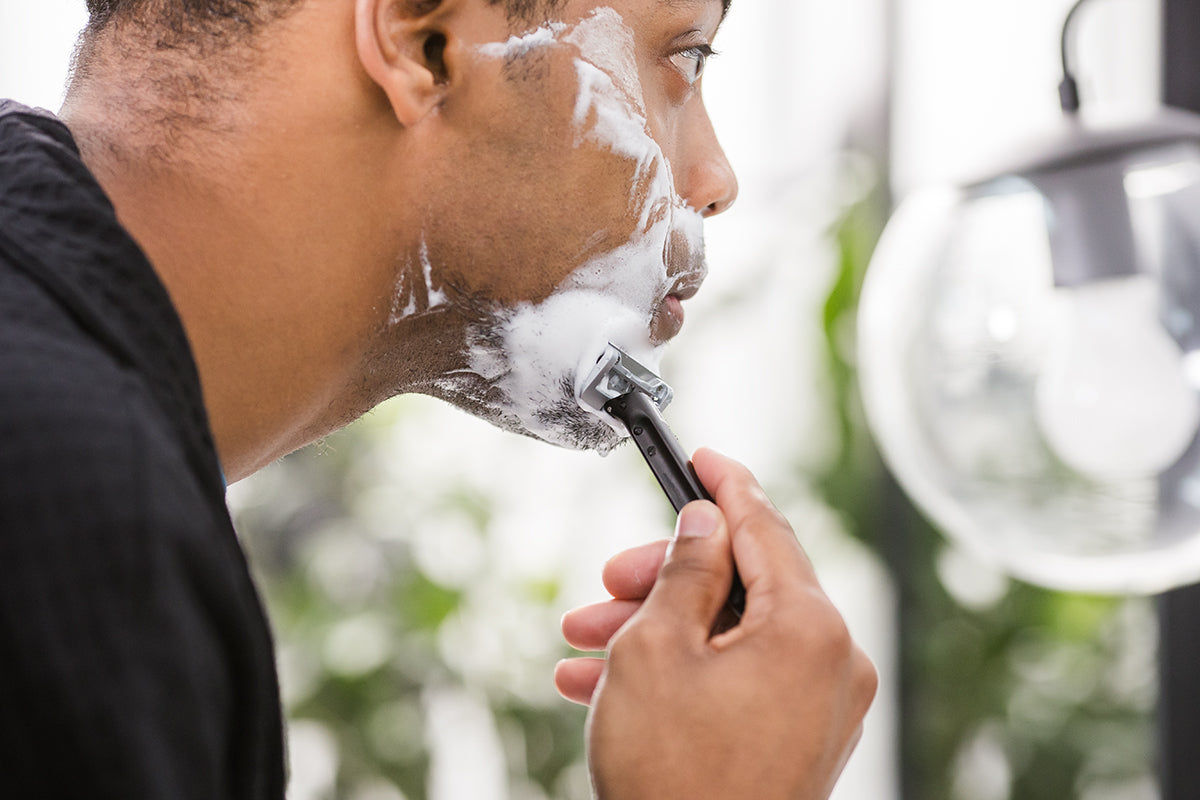 Man Shaving with OneBlade ELEMENT Safety Razor