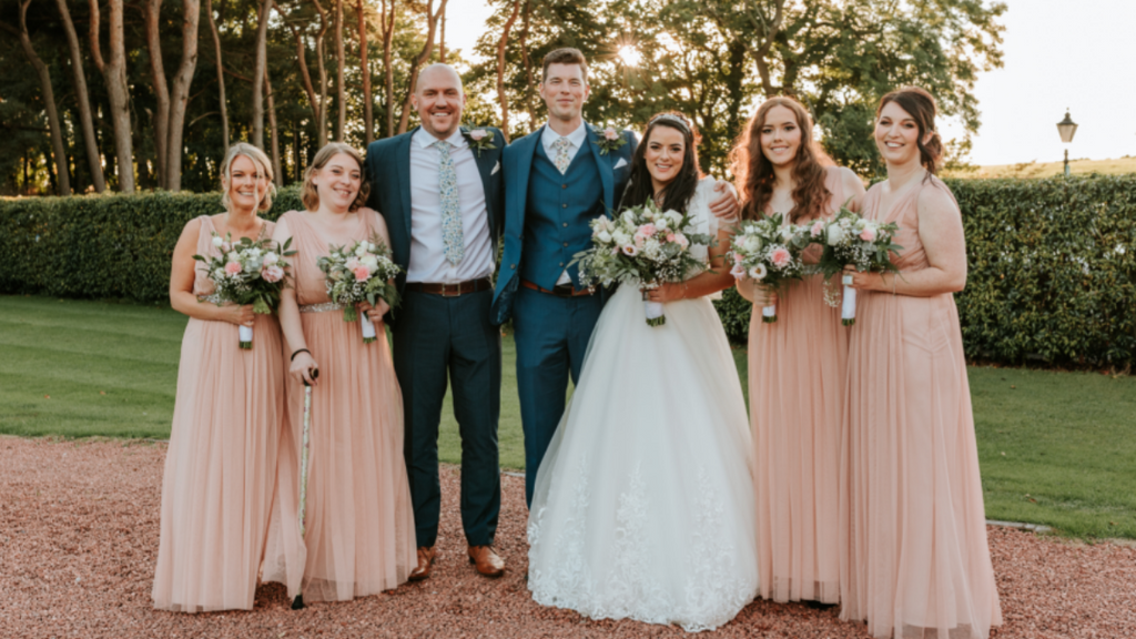My groom didn’t want many groomsmen and chose only to have a best man, his cousin. In this picture, you can see that my bridesmaids were able to choose their own hairstyles – two bridesmaids wore heels and two wore flats!