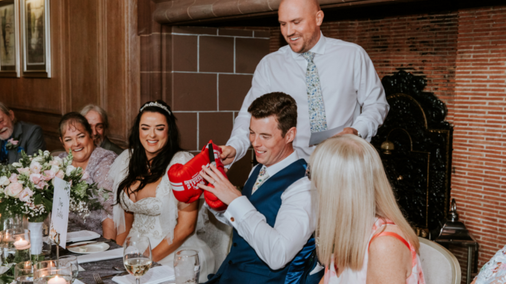 The best man, Andrew, gave the funniest speech and he’s presenting Michael with his very own set of boxing gloves – and telling everyone that when they were growing up they had to share a pair between them and “box” with each other, except Andrew took the advantage each time taking the right glove.