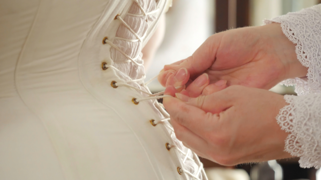 READ THIS BEFORE YOUR SHOP FOR A BRA! - Tria Beauty UK - image of a corset being laced up