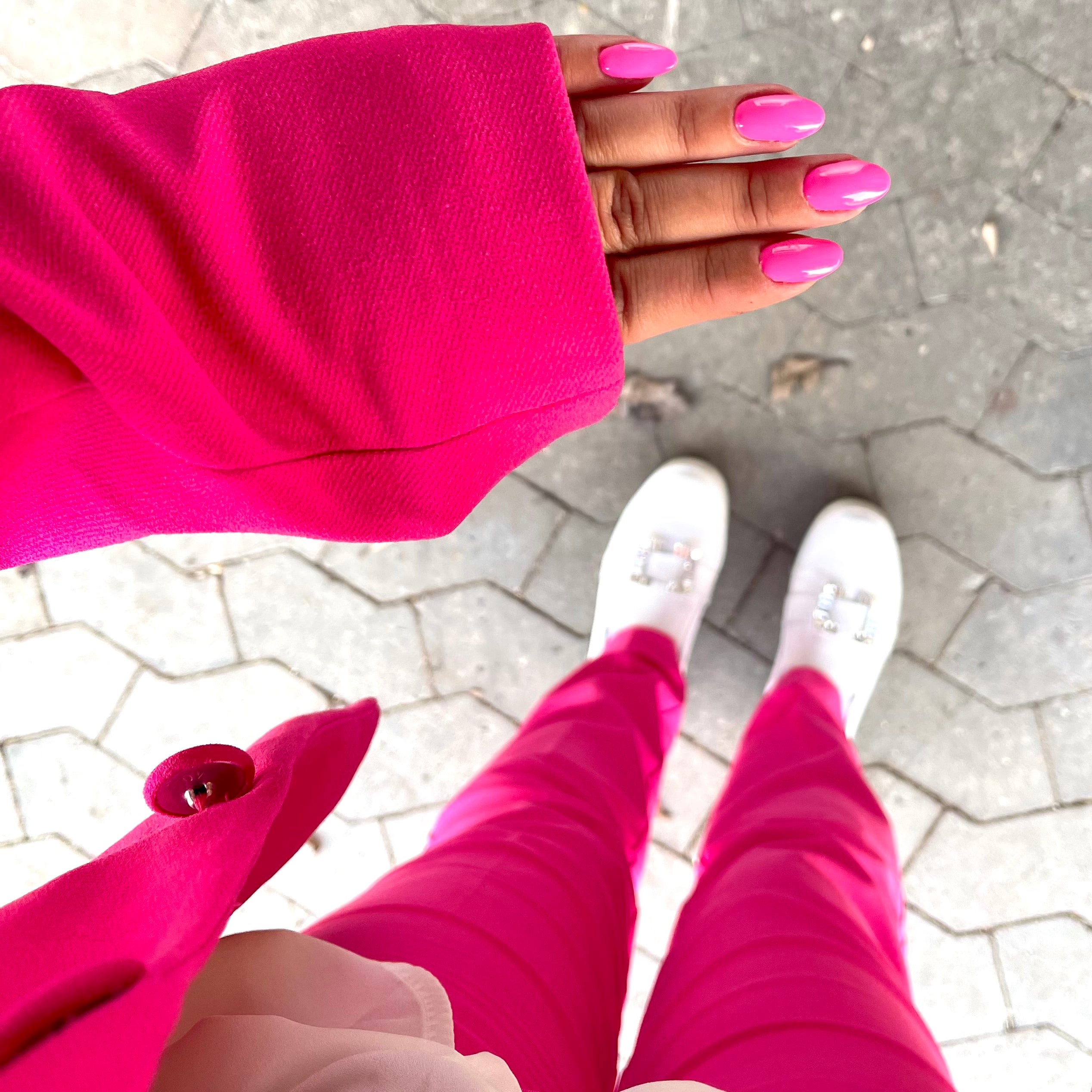 Pink gel polish nails and pink clothes