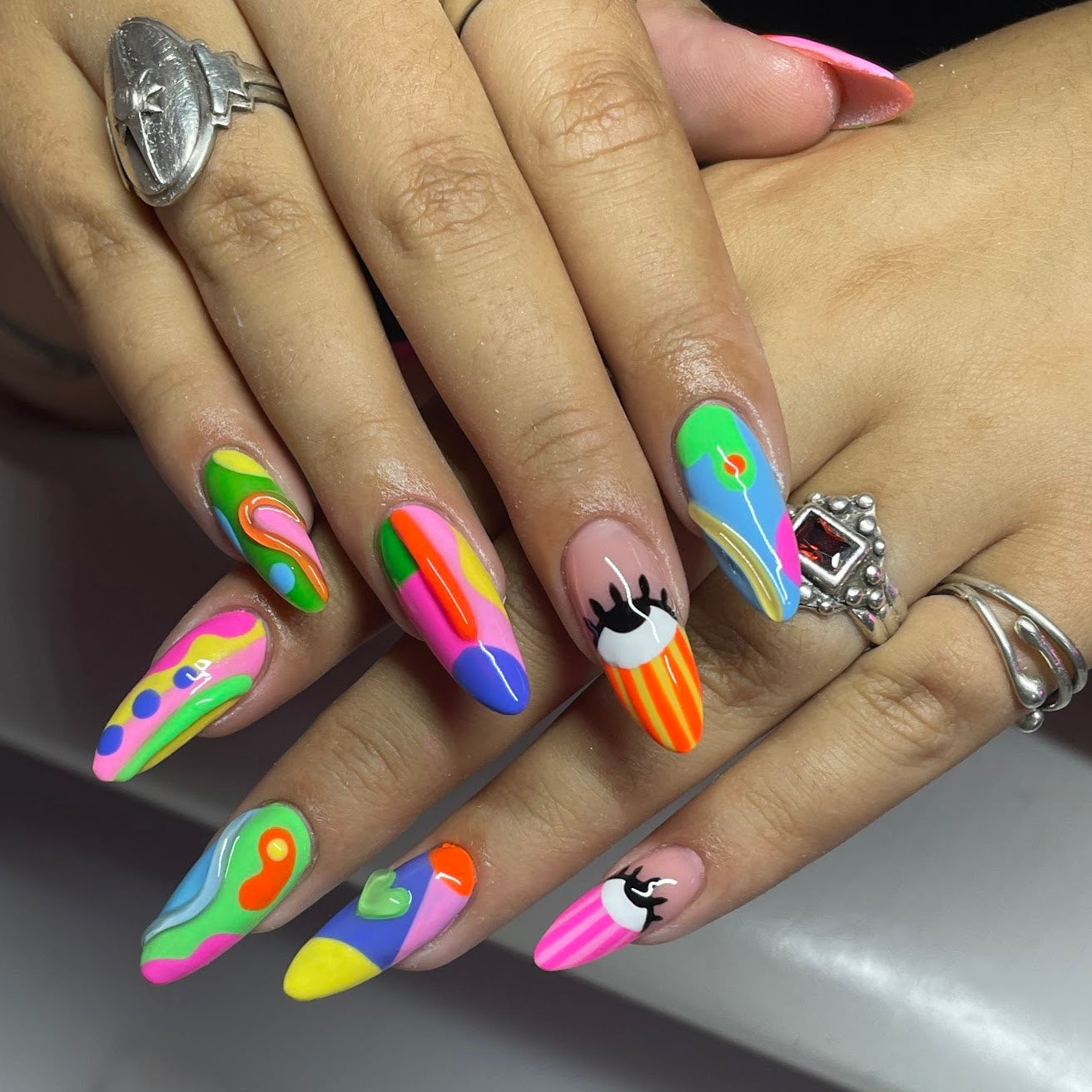 Picasso style nails with many gel polish colors