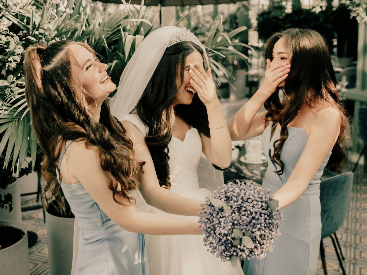 Bride and Bridesmaids Laughing