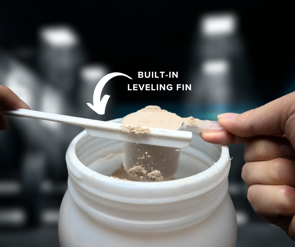 a close-up of someone using a scoop to take protein powder from a container. The scoop is almost overflowing with powder, and there's a leveling tool, referred to as a "Built-In Leveling Fin," being used to remove the excess protein powder and level the scoop's contents.