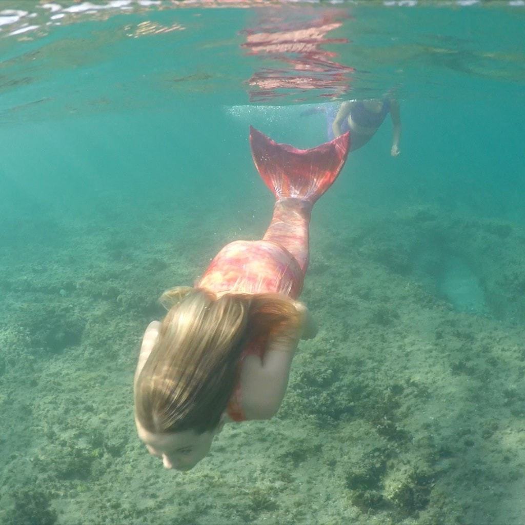 Orange Mermaid Tail in water