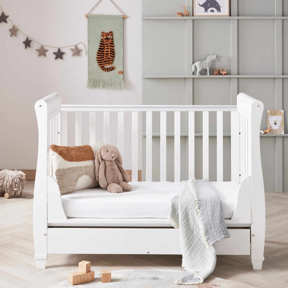 Babymore Eva Sleigh Cot converted into a toddler bed and sofa