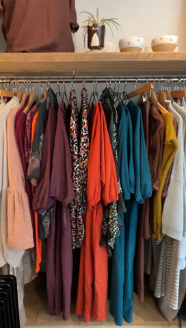 A rail of colourful clothing