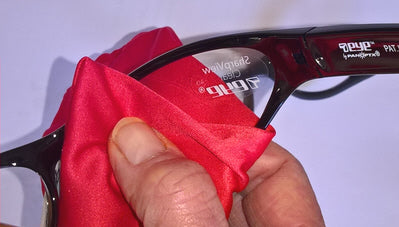 Polishing the lenses with a microfibre cloth