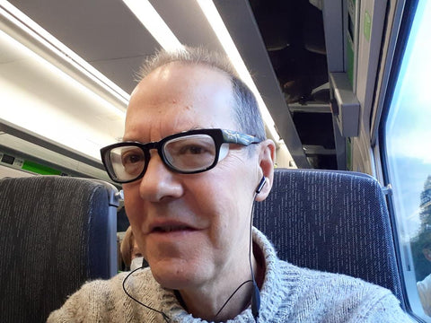 John wearing his Ziena Kai glasses on the train
