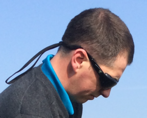 Close up of customer wearing his 7eye Cape for golf