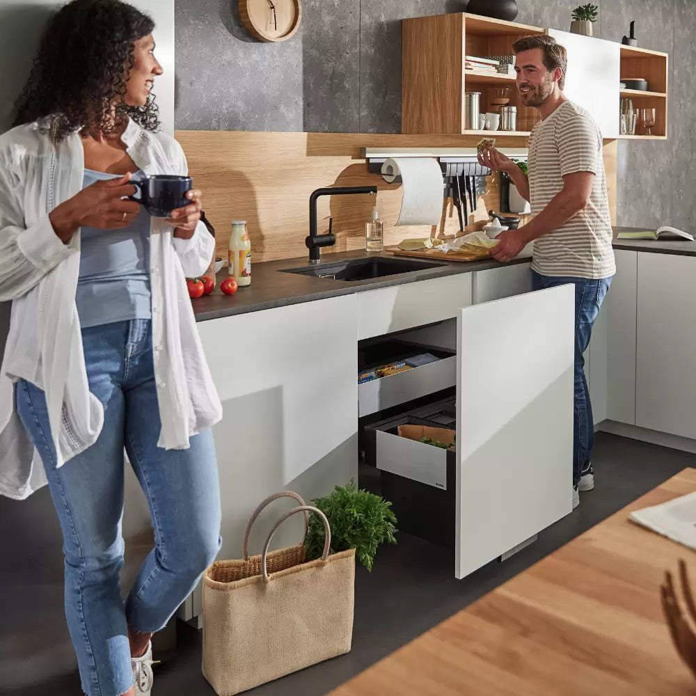 An in-cupboard bin in a sleek, modern kitchen