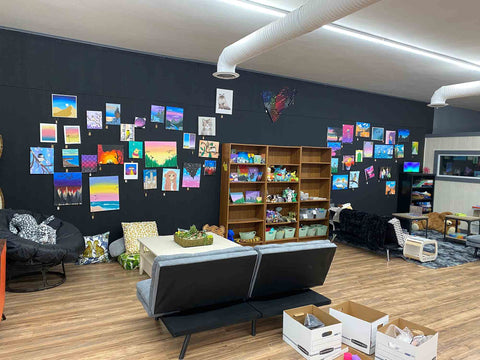 cozy sitting area with art made by teens in the community