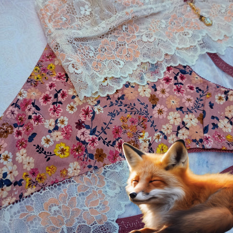 AI image of a fox with Sleepy Foxy lingerie set in the backdrop.