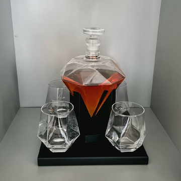 jewel decanter on shelf 4 glasses and whiskey.png__PID:f0835ae8-0767-4e64-8dd0-ef36d16d4a3b