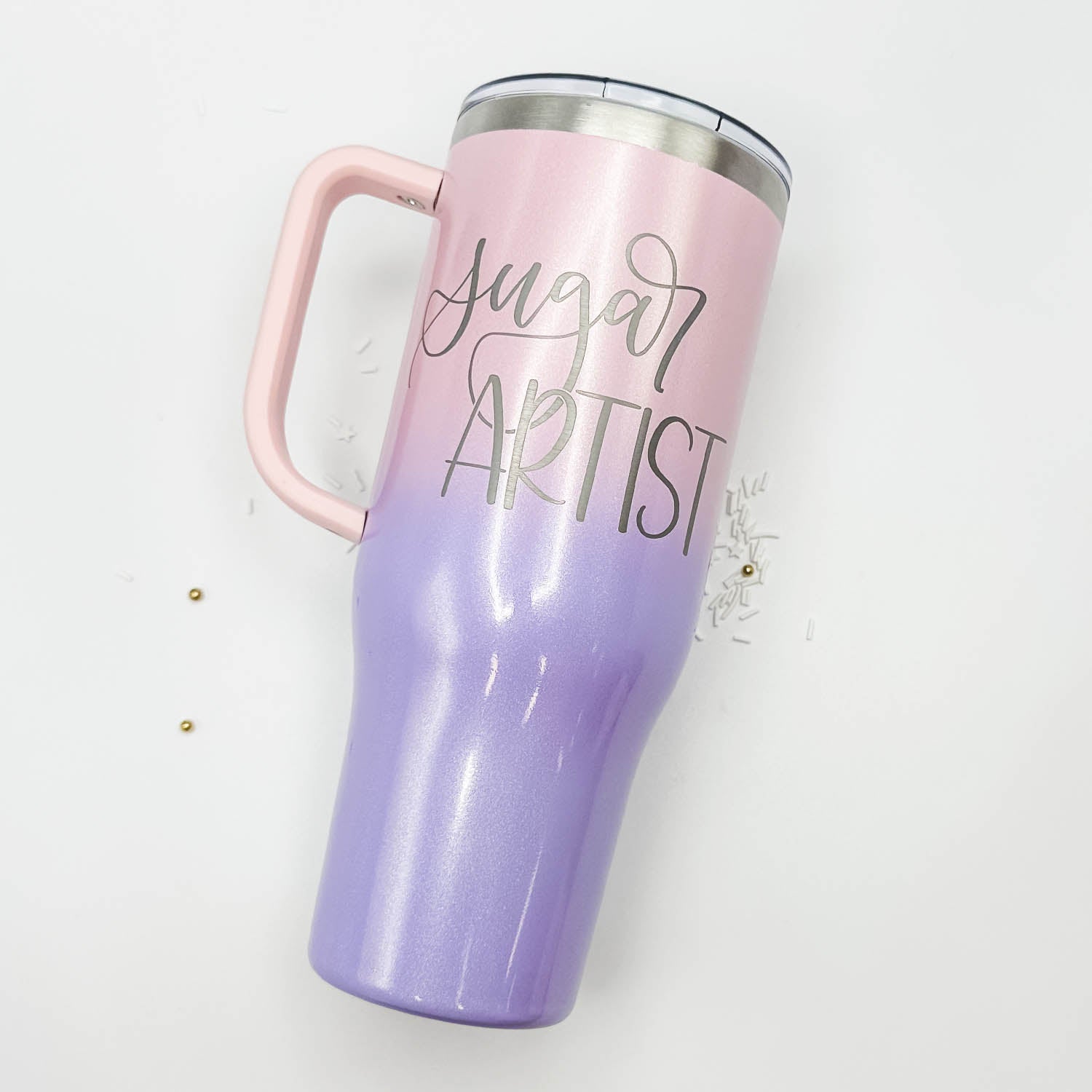 https://cdn.shopify.com/s/files/1/0773/6123/files/BerryGlowGlitter40ozChargerTumbler-SugarArtist_1600x.jpg?v=1694117788