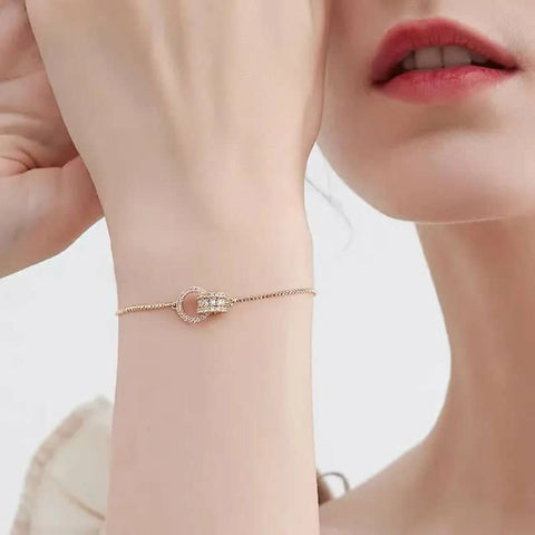 https://trendzonne.com/products/classic-design-ring-interlocki-gold-color-charm-bracelets