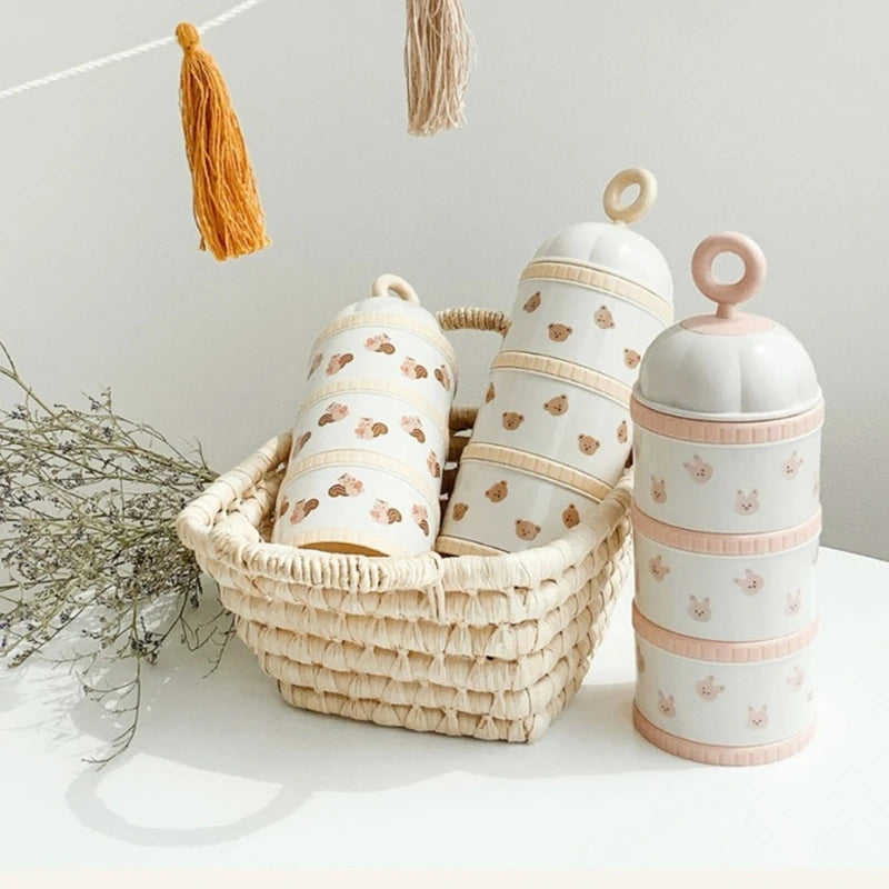 Stackable containers with animal print in a woven basket on a light surface.
