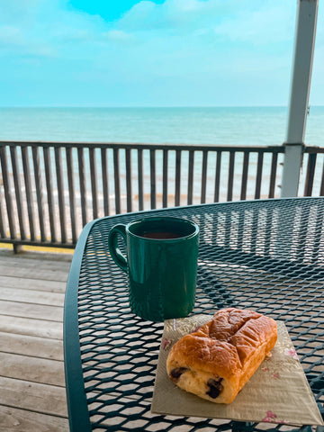 coffee and croissant on deck by lake erie
