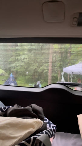 raining during camping looking out of car