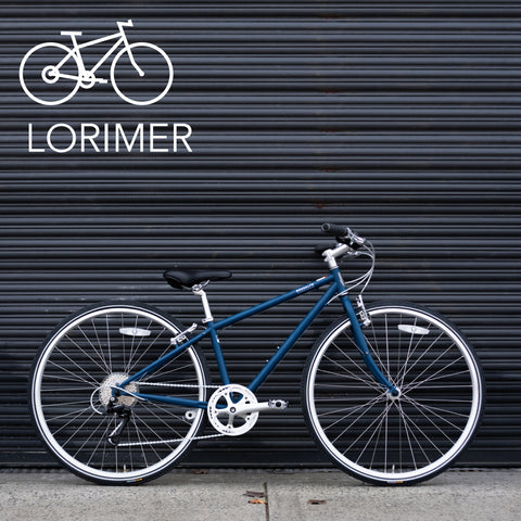 Brooklyn Bicycle Co. Lorimer against black metal gate