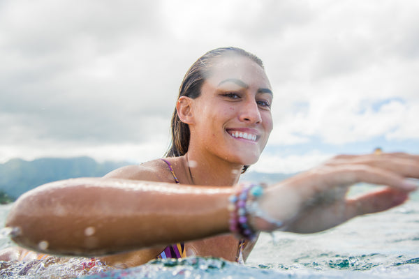 Surfer girl Brittany Penaroza paddling out to catch some waves