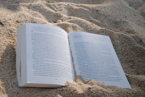 book laying flat on the beach