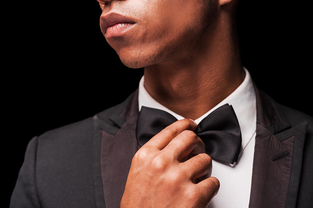 tieing a black bow tie