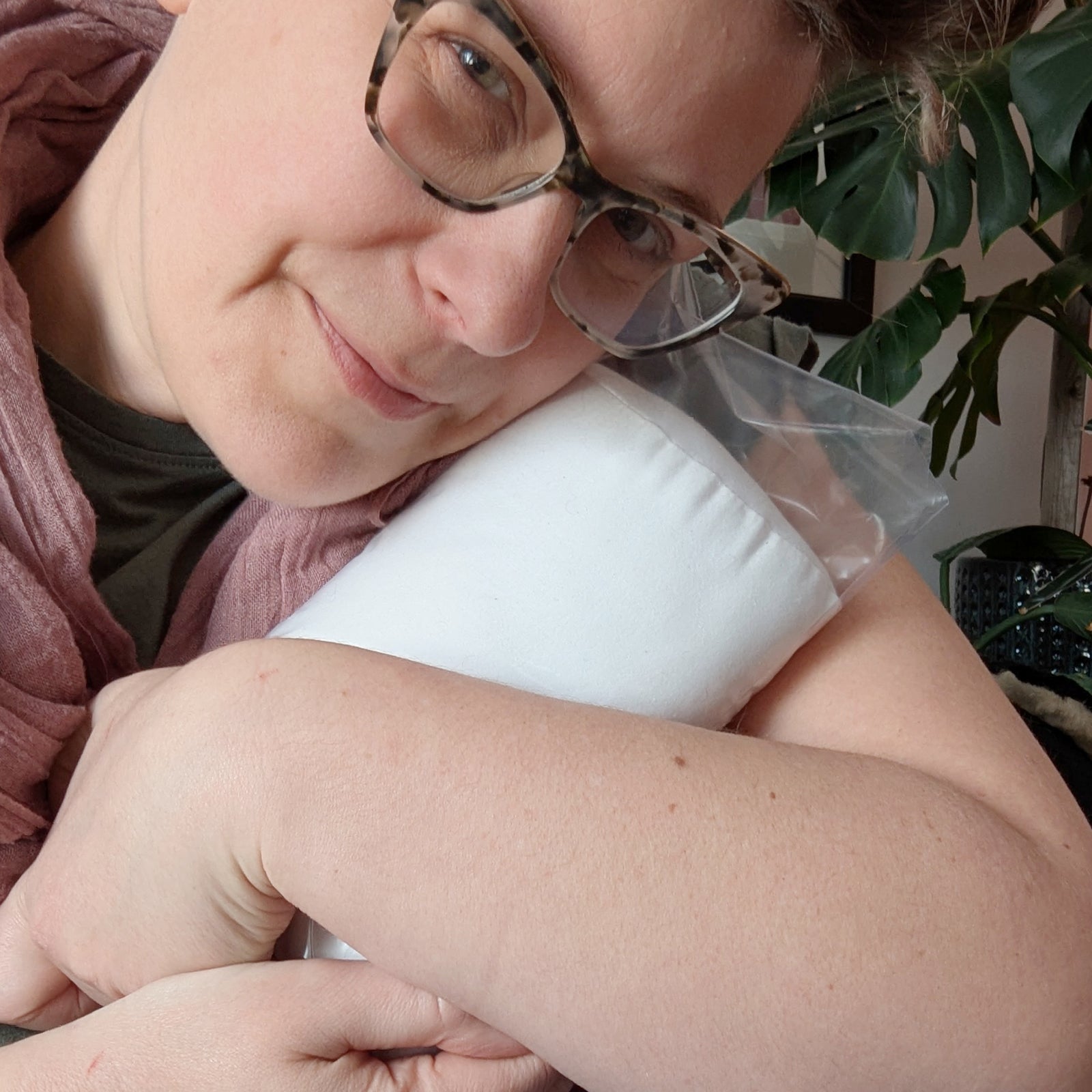 Milk Bag Pillow DIY Kit - Rita Van Tassel cuddling it.