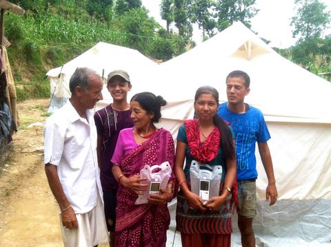 Nepali family receiving lights.