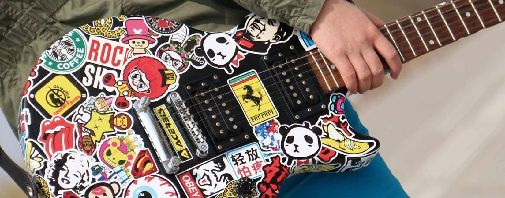 Sticker Bomb Collection on a guitar