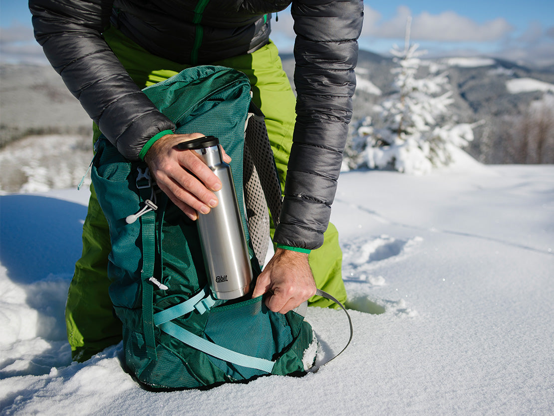 Esbit PICTOR insulated drinking bottle in stainless steel, 750 ml in a backpack