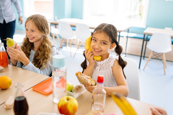 girls having their meal in a classroom