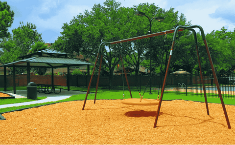 A swing set on engineered wood fiber.