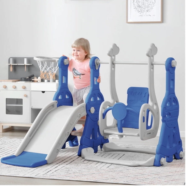 A toddler playing on a plastic swing set indoors.