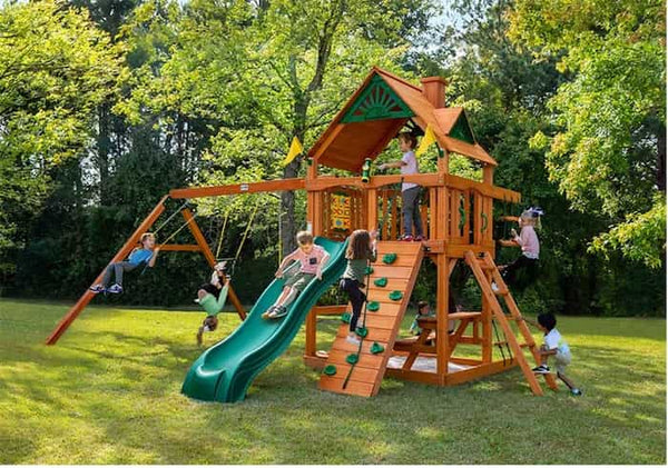 Multiple kids playing on a wooden playset.