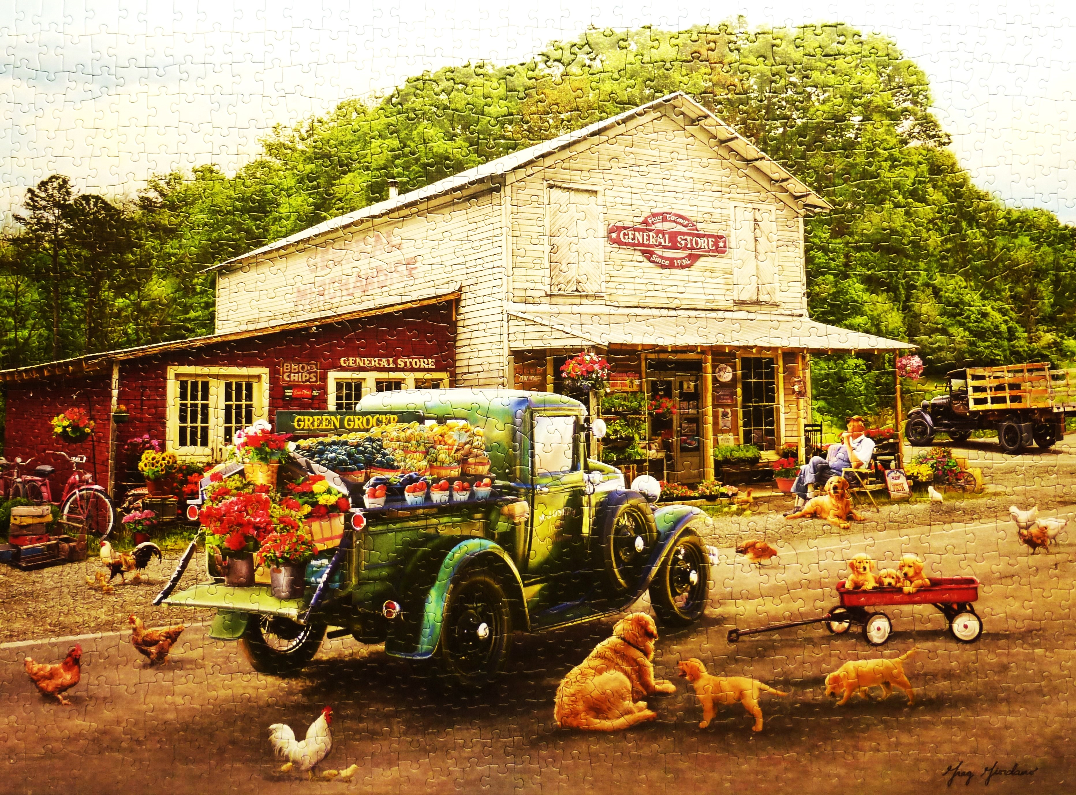a jigsaw puzzle of a green vintage truck in front of a general store in rural area