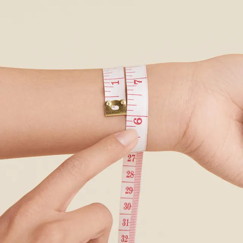 wrist with measuring tape