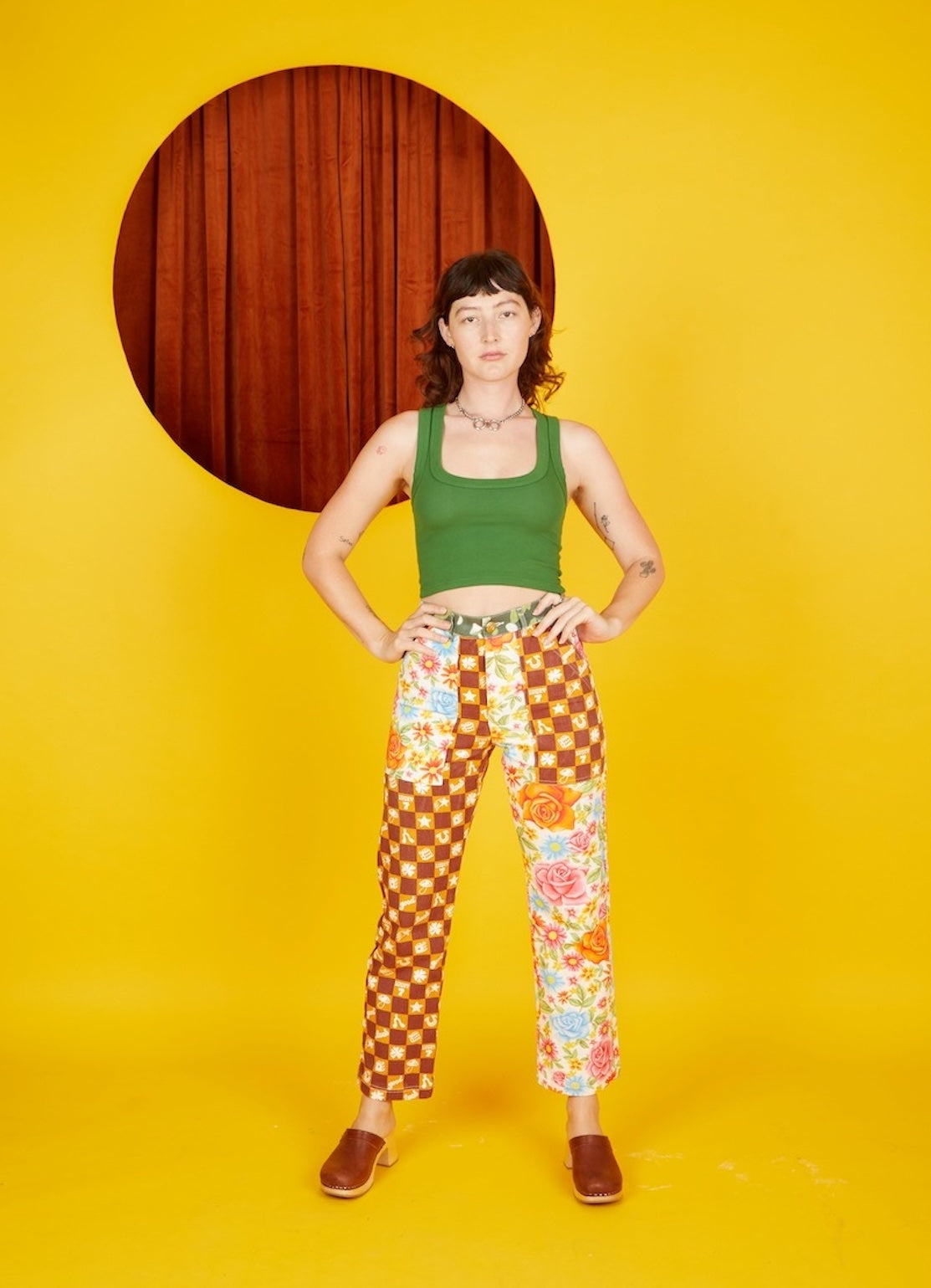Alexandra Skye is wearing Cropped Tank Top in Lawn Green and Mismatched Print Work Pants