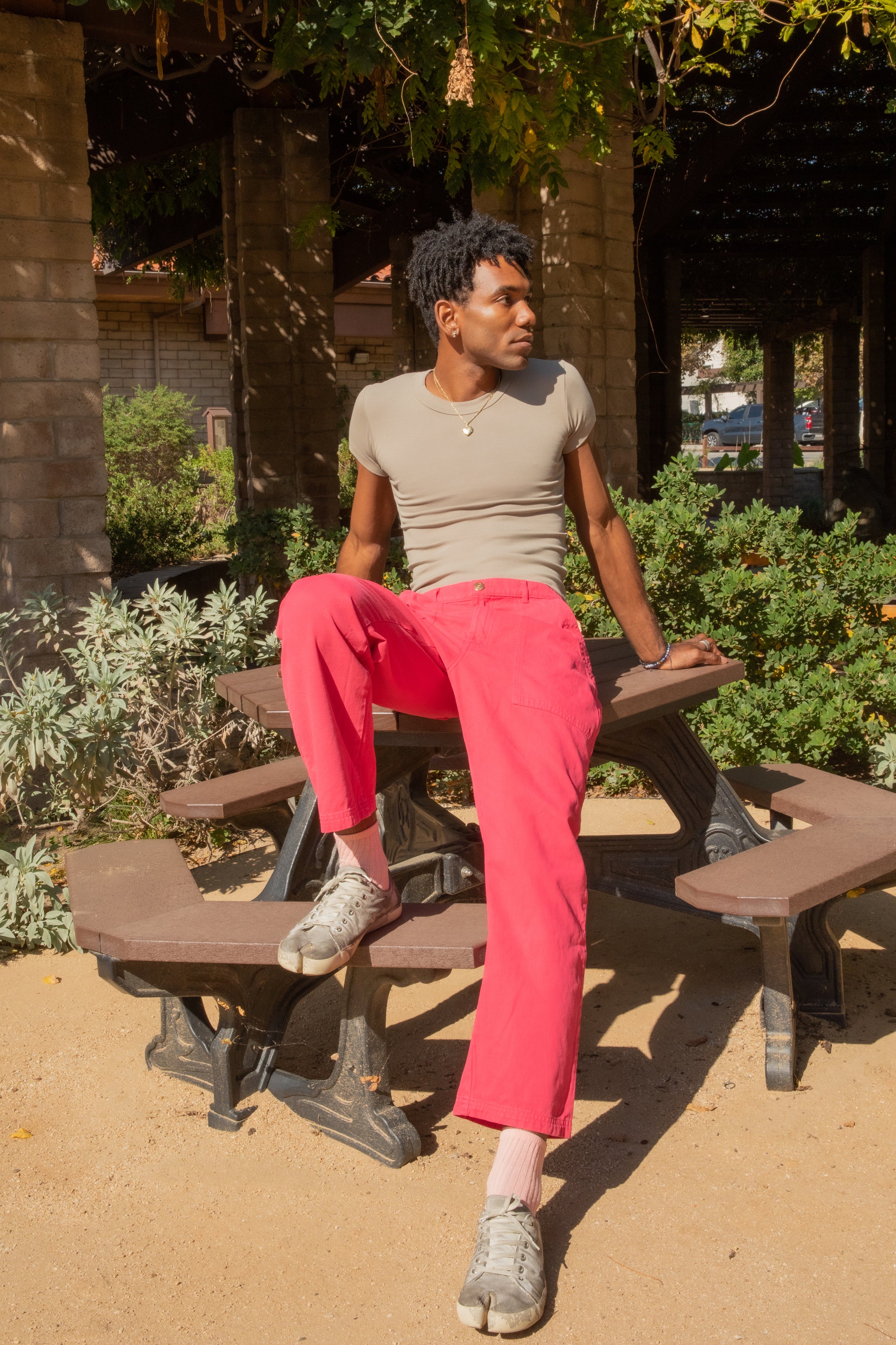 Jerrod wearing Work Pants in Hot Pink and Baby Tee in Khaki Grey