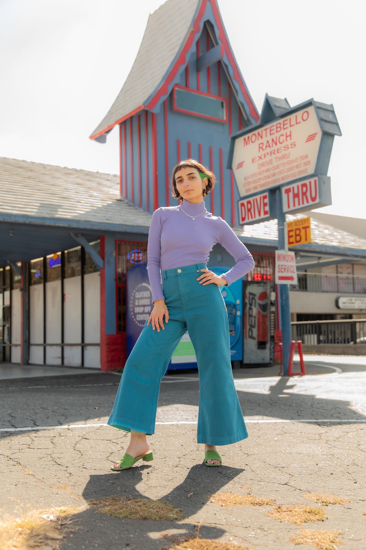 Soraya is wearing Petite Bell Bottoms in Marine Blue and Essential Turtleneck in Faded Grape