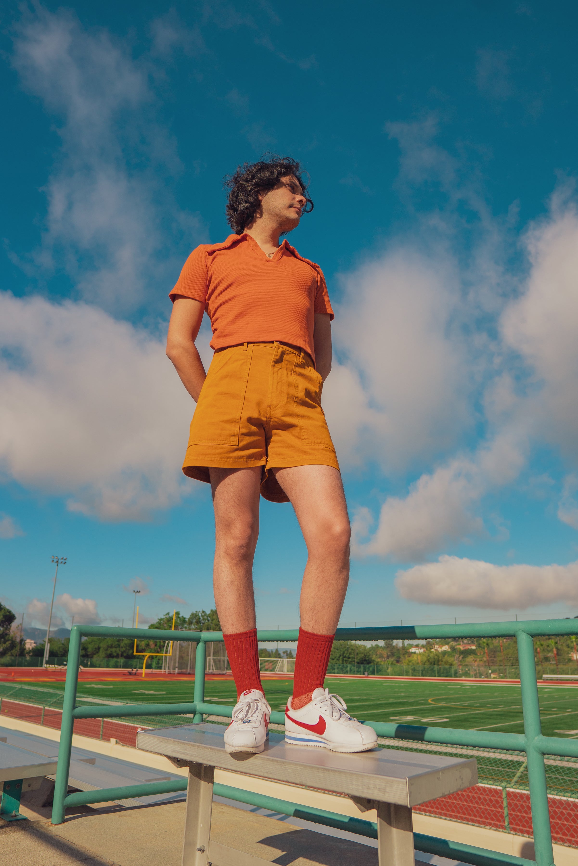 Chris in Short Sleeve Fisherman Polo in burnt orange and Work Shorts in spicy mustard