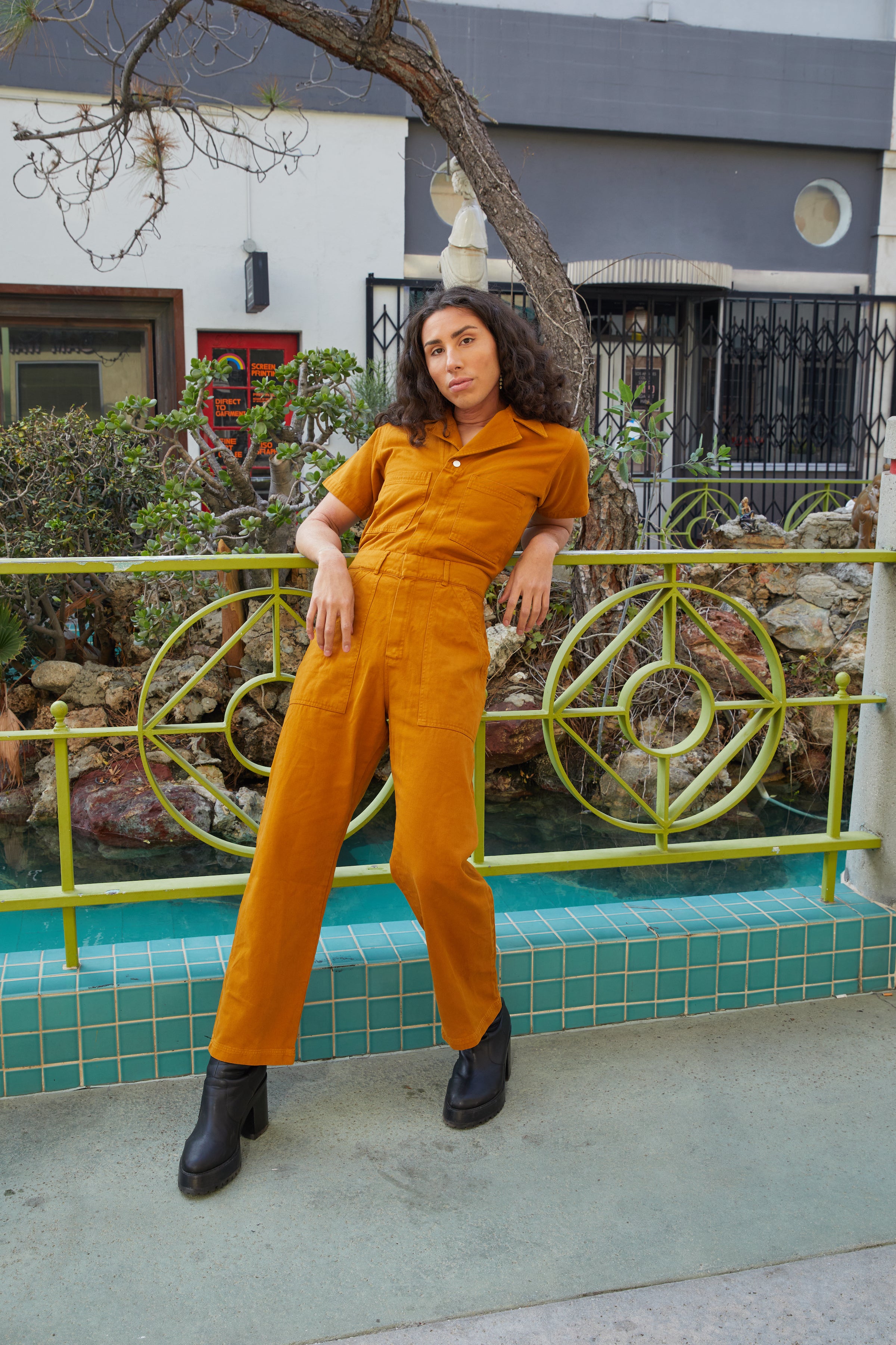 River Gallo wearing Short Sleeve Jumpsuit in Spicy Mustard