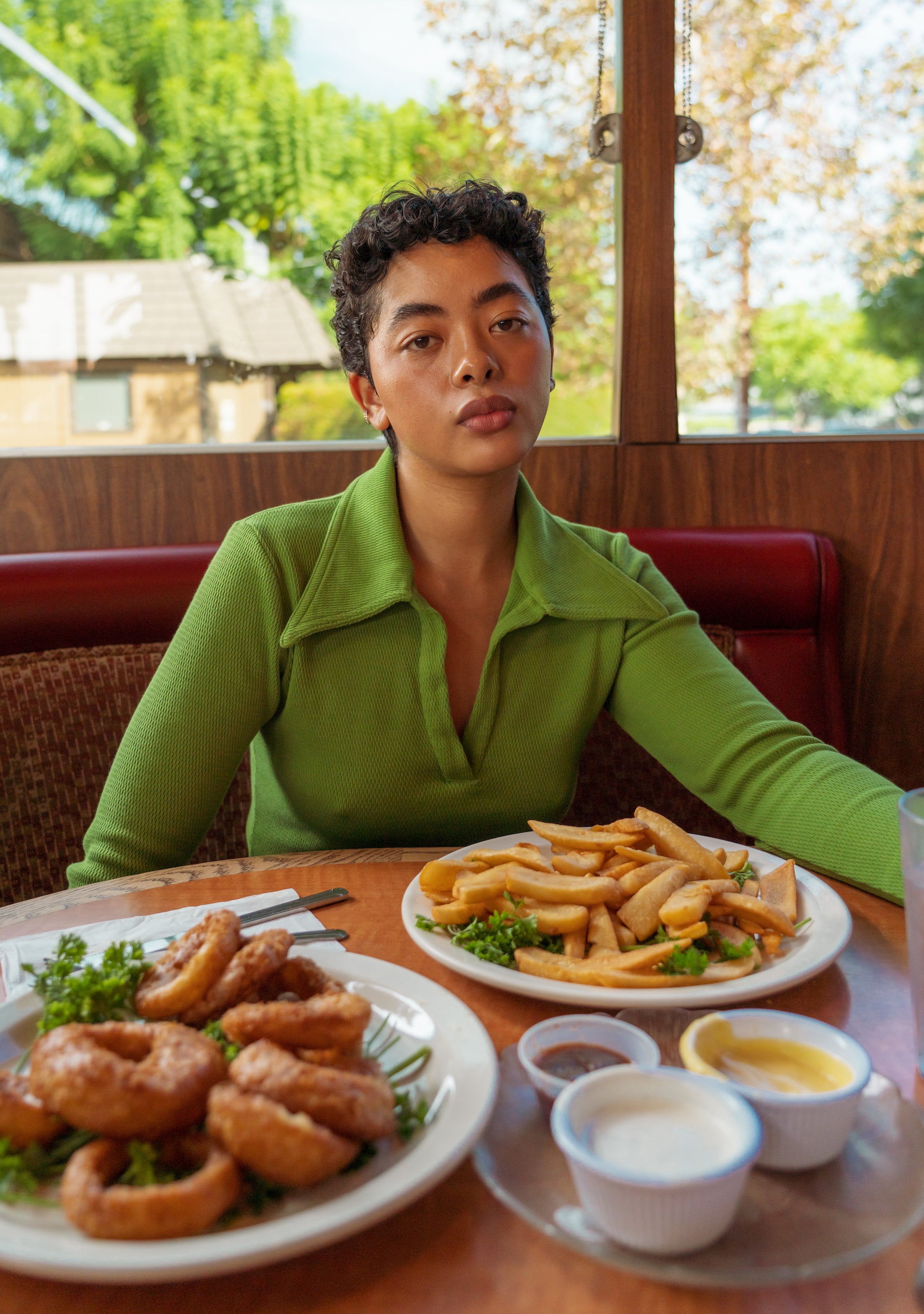 Mika is wearing Long Sleeve Fisherman Polo in Bright Olive and Petite Western Pants in Espresso Brown