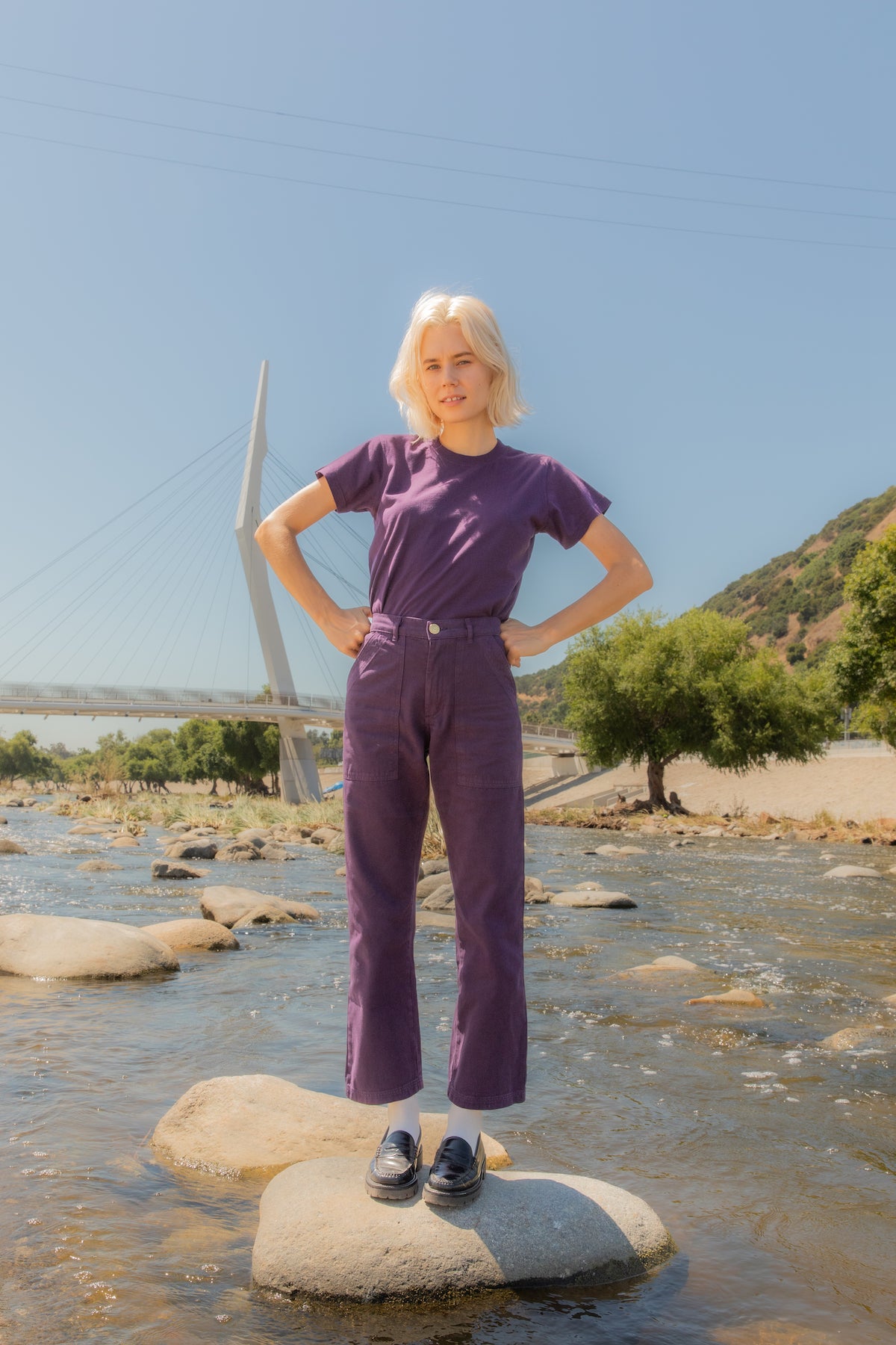 Madeline is wearing The Organic Vintage Tee in Nebula Purple and Work Pants in Nebula Purple