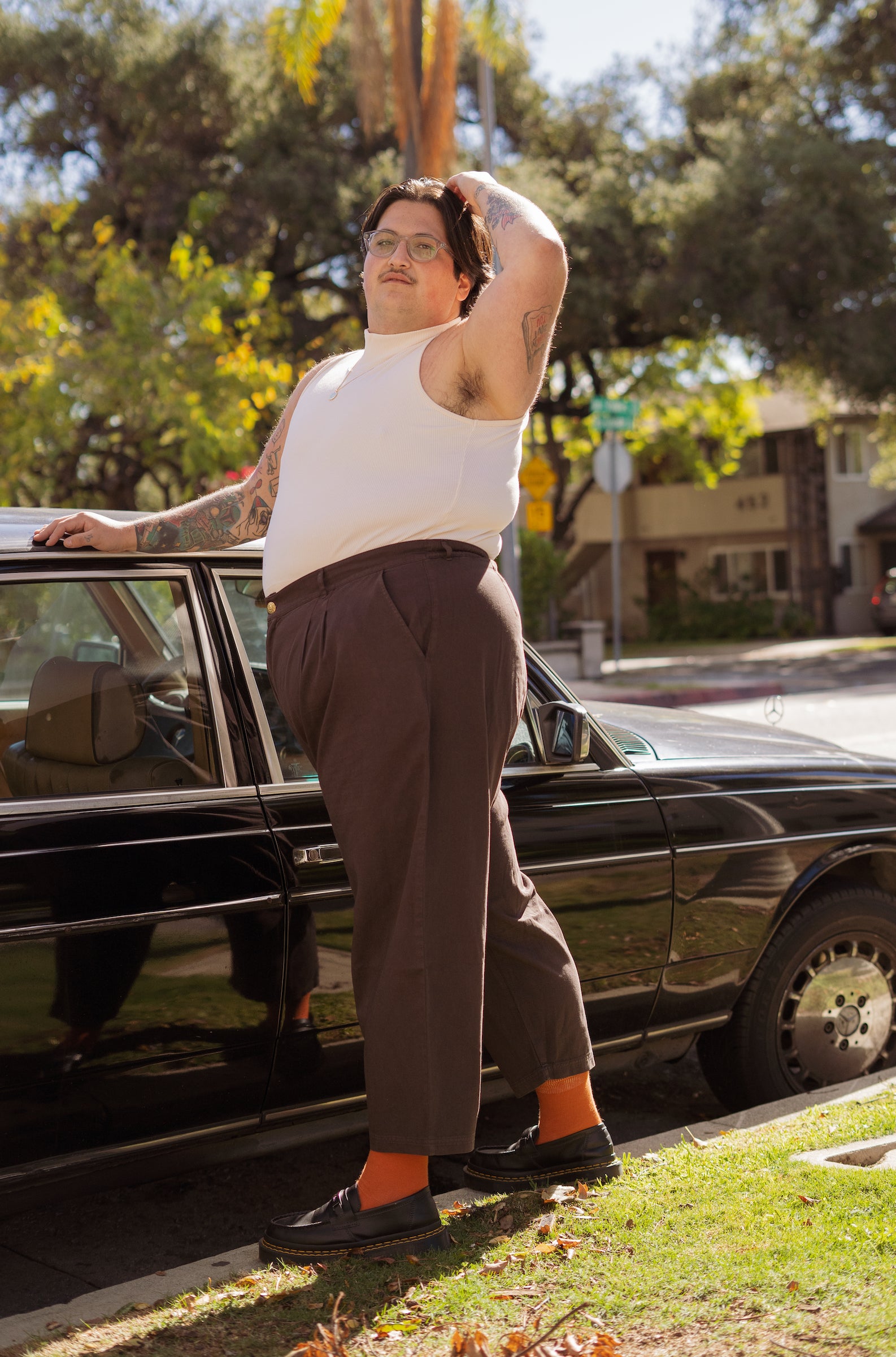 Sam wearing Sleeveless Essential Turtleneck in Vintage Off-White and Trousers in Espresso Brown